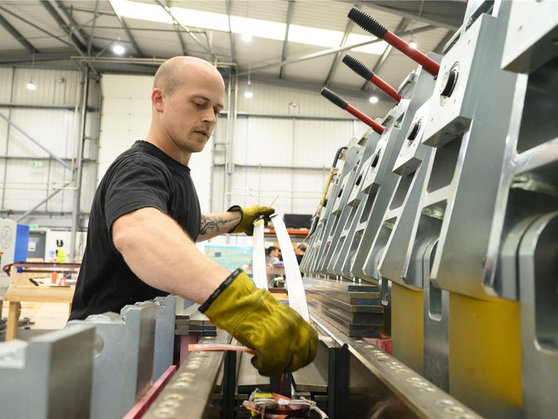 Hand-taping insulation onto a high-voltage bar